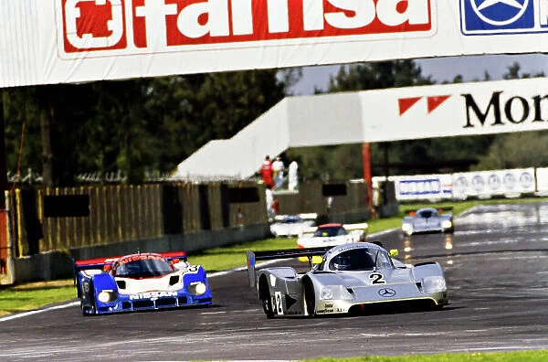 1990 FIA World Sports-Prototype Championship. Mexico 480 Kms. Mexico City, Mexico. 7th October 1990. Rd 9. Jochen Mass  /  Michael Schumacher (Mercedes-Benz C11), 1st position leads Julian Bailey  /  Mark Blundell (Nissan R90CK), 2nd position, action