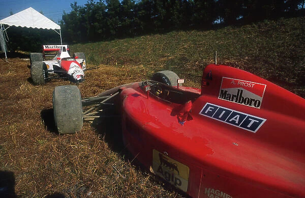 1990 Japanese Grand Prix. Suzuka, Japan. 19-21 October 1990. The wrecked cars of Alain Prost (Ferrari 641) and Ayrton Senna (McLaren MP4 / 5B Honda) after their collision at the start, action. World Copyright: LAT Photographic. Ref: 90 JAP 06