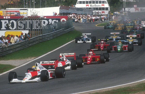 1990 Portuguese Grand Prix. Estoril, Portugal. 21-23 September 1990. Ayrton Senna leads teammate Gerhard Berger (both McLaren MP4 / 5B Honda's), Nigel Mansell (Ferrari 641), Nelson Piquet (Benetton B190 Ford), Alain Prost (Ferrari 641)
