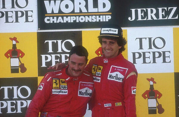 1990 Spanish Grand Prix. Jerez, Spain. 28-30 September 1990. Alain Prost, 1st position celebrates on the podium with teammate Nigel Mansell (both Ferrari), 2nd position. Ref-90 ESP 02. World Copyright - LAT Photographic