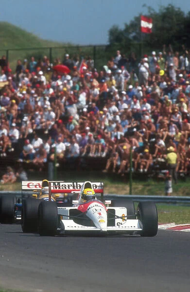 1991 Hungarian Grand Prix. Hungaroring, Hungary. 9-11 August 1991. Ayrton Senna (McLaren MP4 / 6 Honda) closely followed by Riccardo Patrese (Williams FW14 Renault)