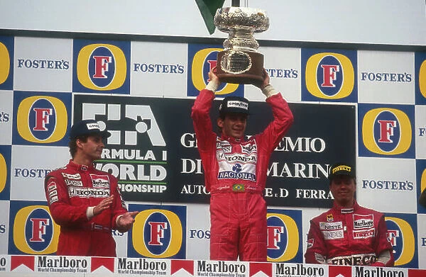 1991 San Marino Grand Prix. Imola, Italy. 26-28 April 1991. Ayrton Senna (McLaren MP4 / 6 Honda) celebrates 1st position with Gerhard Berger (McLaren MP4 / 6 Honda) 2nd position and J.J