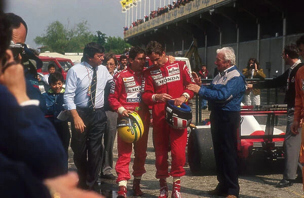 1991 San Marino Grand Prix. Imola, Italy. 26-28 April 1991. Ayrton Senna, 1st position chats to teammate Gerhard Berger, 2nd position in parc ferme after the race. FIA Race Director and Starter Roland Bruynseraede walks along with them