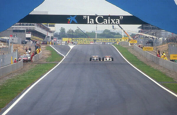 1991 Spanish Grand Prix. Barcelona, Spain. 27-29 September 1991. Nigel Mansell (Williams FW14 Renault) battles wheel to wheel with Ayrton Senna (McLaren MP4 / 6 Honda)