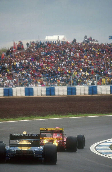 1991 Spanish Grand Prix. Barcelona, Spain. 27-29 September 1991. Jean Alesi's Ferrari 643 spews flames out behind him, with Nelson Piquet (Benetton B191 Ford) closely following. Ref-91 ESP 06. World Copyright - LAT Photographic