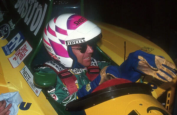 1992 Australian Grand Prix. Adelaide, Australia. 6-8 November 1992. Wayne Gardner, the 1987 World 500cc Motorcycle Champion prepares before taking the Lotus 107 Ford out for a two lap drive of the Adelaide circuit on Sunday Morning. Ref-92 AUS