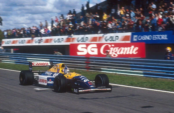 1992 Portuguese Grand Prix. Estoril, Portugal. 25-27 September 1992. Nigel Mansell (Williams FW14B Renault) celebrates 1st position. Ref-92 POR 03. World Copyright - LAT Photographic