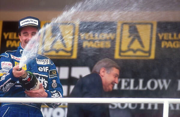1992 South African Grand Prix. Kyalami, South Africa. 28 / 2-1 / 3 1992. Nigel Mansell (Williams Renault) celebrates 1st position on the podium. Ref-92 SA 07. World Copyright - LAT Photographic