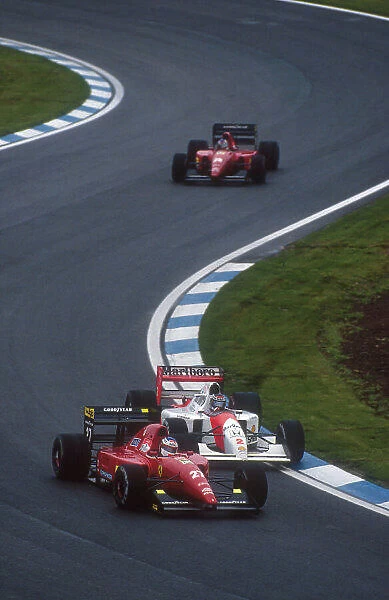 1992 Spanish Grand Prix. Barcelona, Spain. 1-3 May 1992. Jean Alesi (Ferrari F92A) passes Gerhard Berger (McLaren MP4 / 7A) with Ivan Capelli (Ferrari F92A) behind. Ref-92 ESP 08. World Copyright - LAT Photographic