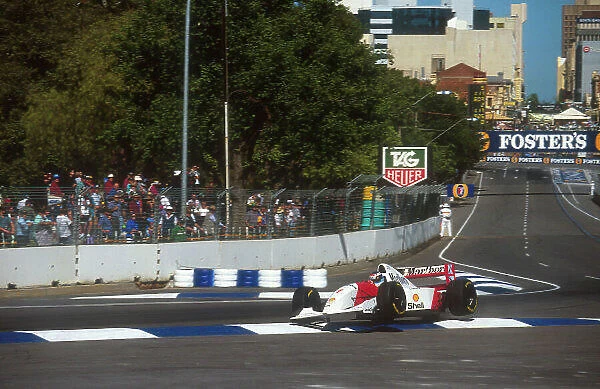 1993 Australian Grand Prix. Adelaide, Australia. 5-7 November 1993. Mika Hakkinen (McLaren MP4 / 8 Ford) gets airborn after going wide over the kerb. He exited the race after his left rear brake pipe leaked. Ref-93 AUS 05. World Copyright - LAT
