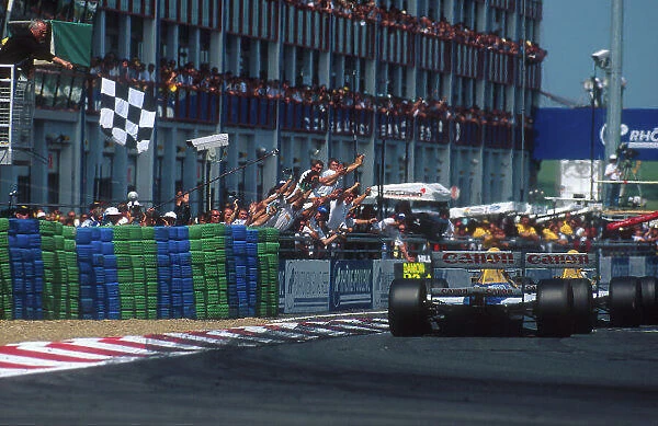 1993 French Grand Prix. Magny-Cours, France. 2-4 July 1993. Alain Prost (Williams FW15C Renault) takes the chequered flag for 1st position just ahead of teammate Damon Hill (Williams FW15C Renault)