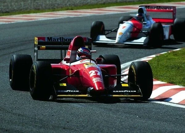 1993 PORTUGUESE GP. Ferraris Jean Alesi leads McLarens Mika Hakkinen to eventually