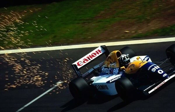 1993 PORTUGUESE GP. Pole Position Man Damon Hill sparks up the road