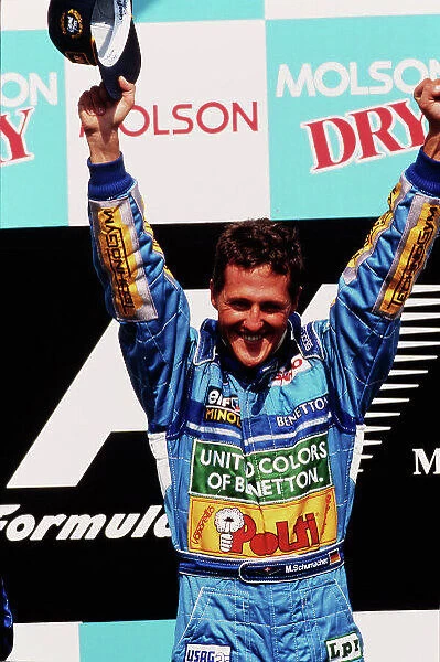 1994 Canadian Grand Prix. Montreal, Quebec, Canada. 10-12 June 1994. Michael Schumacher (Benetton Ford) celebrates 1st position on the podium. Ref-94 CAN 03. World Copyright - LAT Photographic