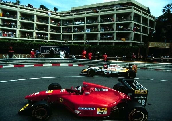 1994 MONACO GP. Gerhard Berger overtakes the Lotus of Johnny Herbert at the Lowes