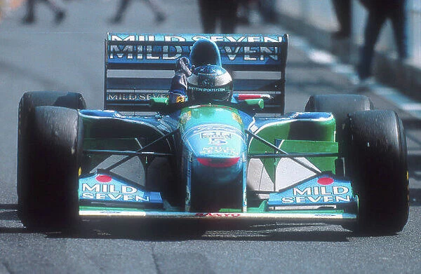 1994 Pacific Grand Prix. Tanaka International, Aida, Japan. 15-17 April 1994. Michael Schumacher (Benetton B195 Ford) celebrates 1st position. Ref-94 PAC 09. World Copyright - LAT Photographic