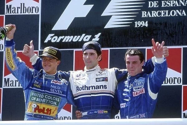 1994 Spanish Grand Prix. Catalunya, Barcelona, Spain. 27th - 29th May 1994. Damon Hill (Williams FW16 Renault) 1st position salutes the crowd with Michael Schumacher (Benetton B194 Ford) 2nd position and Mark Blundell (Tyrrell Yamaha 022)