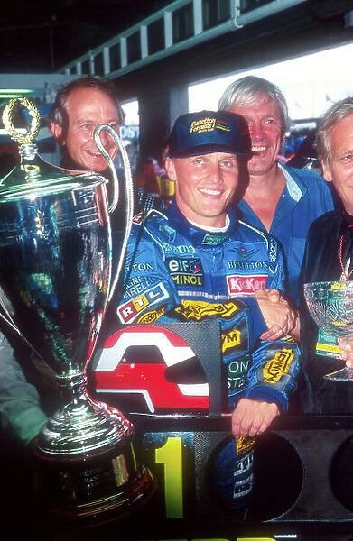 1995 British Grand Prix. Silverstone, England. 14-161 July 1995. Johnny Herbert (Benetton Renault) with trophy, celebrates his 1st position and maiden Grand Prix win. Ref-95 GB 20. World Copyright - LAT Photographic
