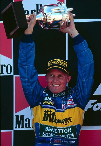 1995 SPANISH GP. Johnny Herbert finishes 2nd on the podium behind team mate Michael Schumacher in Barcelona. Photo: LAT