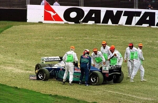 1997 AUSTRALIAN GP. Johnny Herbert and Jacques Villeneuve are both taken off at