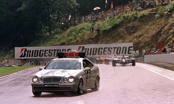 1997 BELGIAN GP. THE PACE CAR LEADS THE FIELD FOR 3 LAPS BEFORE A ROLLING START TO THE