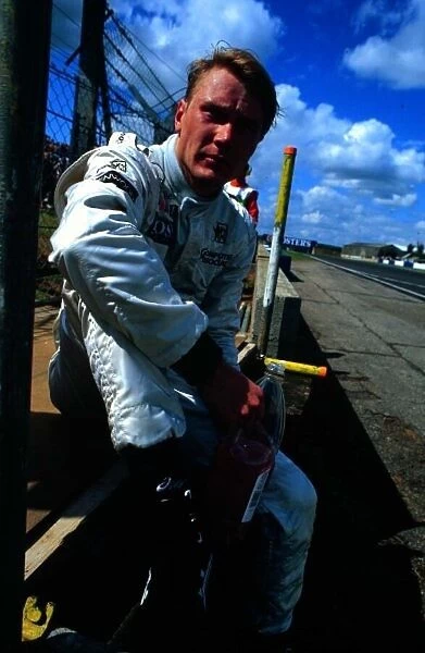 1997 BRITISH GP. Mika Hakkinen after his engine blew whilst leading the race