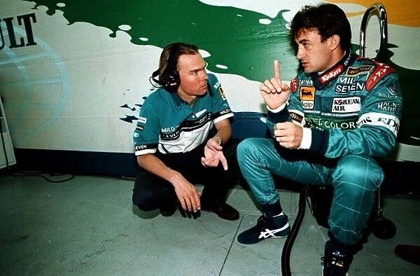 1997 CANADIAN GP. Benettons Jean Alesi chats with his chief mechanic pre-race. Photo: LAT