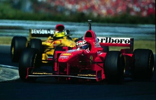 1997 HUNGARIAN GP. Michael Schumacher followed by his brother Ralf at the Hungaroring. Photo: LAT  /  Coates