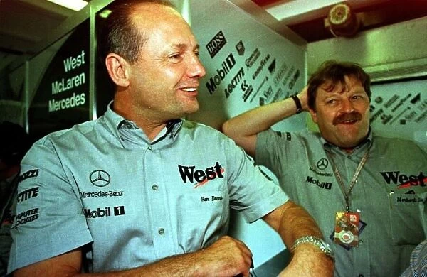 1997 HUNGARIAN GP. Ron Dennis and Norbert Haug enjoy David Coulthards encouraging