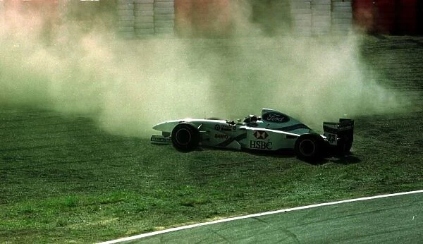 1997 JAPANESE GP. Rubens Barrichello spins off. Photo: LAT
