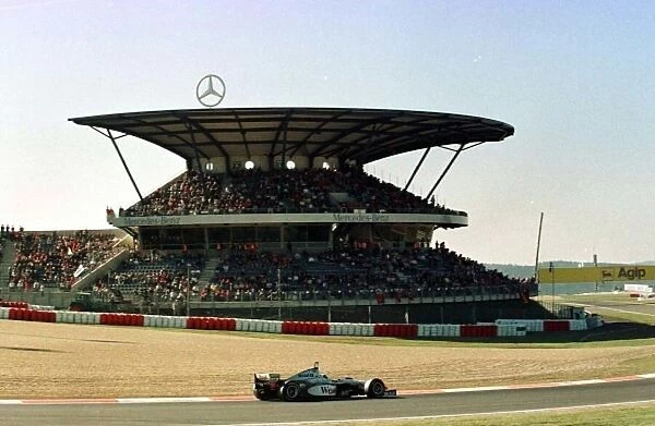 1997 LUXEMBOURG GP. MCLAREN MERCEDES DRIVER DAVID COULTHARD IN QUALIFYING FOR SUNDAYS