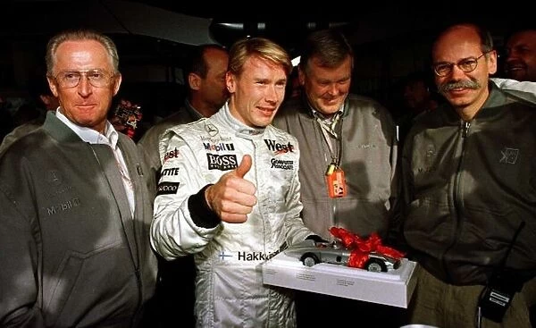 1997 LUXEMBOURG GP. Mika Hakkinen celebrates Pole position at the Nurburgring with