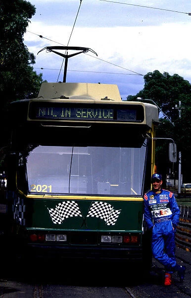 1998 AUSTRALIAN GP. Alexander Wsrz stands next to one of Melbournes famous tram