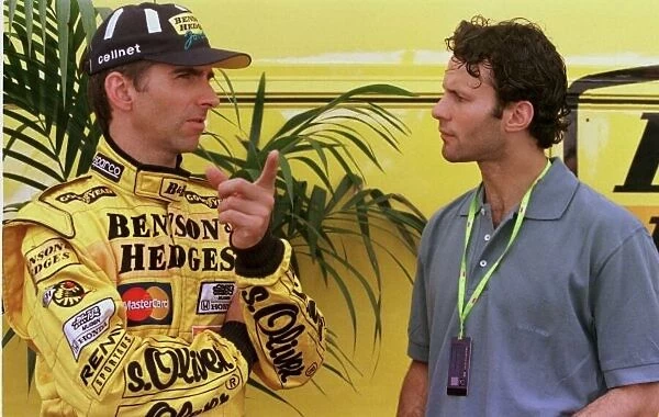 1998 MONACO GP. Damon Hill chats to the Manchester United and Wales Football star Ryan Giggs before the qualifying session in Mont Carlo. Photo: LAT