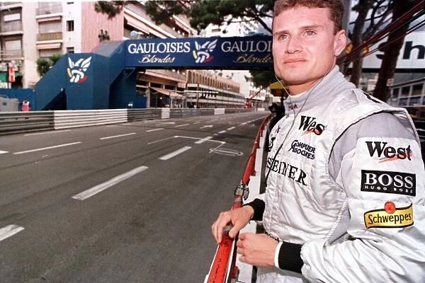 1998 MONACO GP. David Coulthard, McLaren Mercedes, surveys the start  /  finish straight