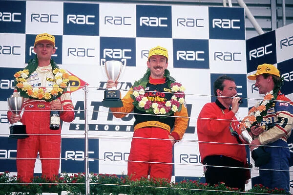 1998 National Saloon Car Cup. Silverstone, Great Britain. 11th July 1998. Rd 8. L to R: Toni Ruokonen (Honda Integra R), 2nd position, Andy Middlehurst (Nissan Primera GT), 1st position and being interviewed, Lionel Abbott (Saab 9. 3)