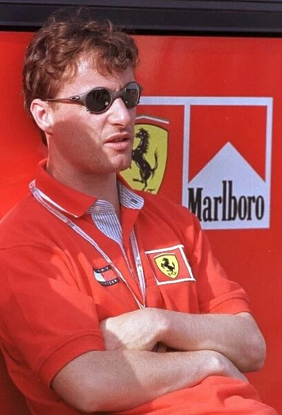 1998 SAN MARINO GP. Eddie Irvine, Ferrari relaxes after qualifying 4th
