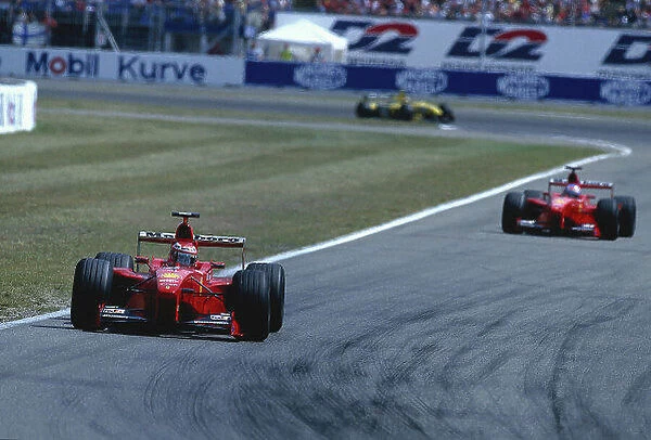 1999 German Grand Prix. Hockenheim, Germany. 30 / 7-1 / 8 1999. Eddie Irvine (Ferrari F399) 1st position, followed by team mate Mika Salo (Ferrari F399) 2nd position. Ref-99 GER 02. World Copyright - LAT Photographic