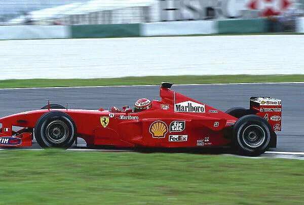1999 Malaysian Grand Prix. Sepang, Kuala Lumpur, Malaysia. 15-17 October 1999. Eddie Irvine (Ferrari F399) 1st position. Ref-99 MAL 03. World Copyright - LAT Photographic