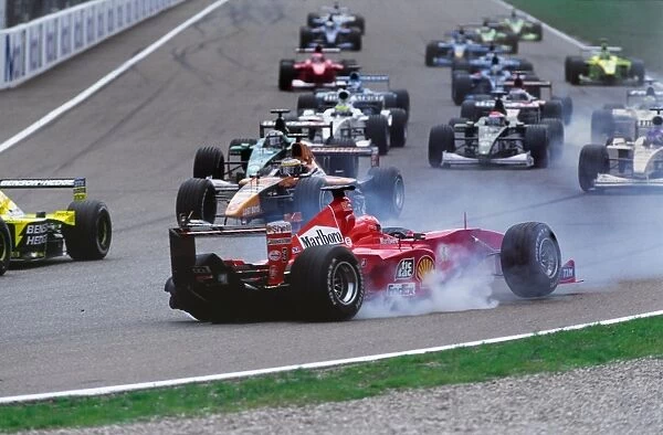 2000 German Grand Prix: The field files through after Michael Schumacher pulled across into Giancarlo Fisichella on the approach to the Nordkurve at the start