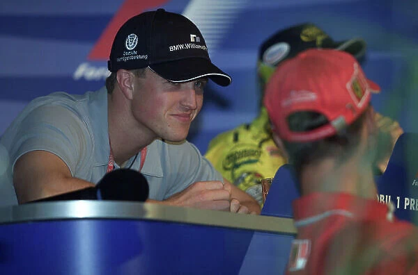 2000 German Grand Prix Hockenheim, Germany, 27th - 30th July 2000. Michael Schumacher talks with brother Ralf Schumacher, at the Thursday afternoon press conference. World Etherington /  LAT Photographic 18 mb Digital: Preview