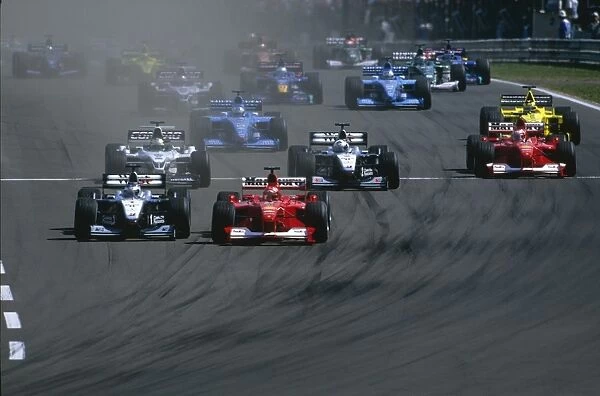 2000 Hungarian Grand Prix: Michael Schumacher tries to block Mika Hakkinen, as Ralf Schumacher, David Coulthard and Rubens Barrichello battle