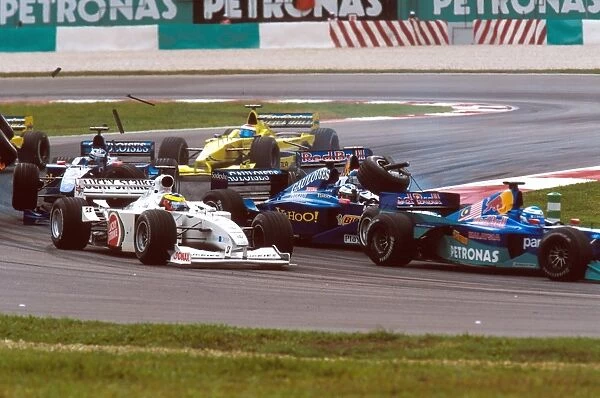 2000 Malaysian Grand Prix: Pedro de la Rosas is lauched into the air as Pedro Dinizs front wheel lands on Jean Alesi s