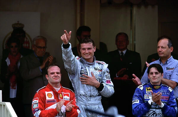2000 Monaco Grand Prix. RACE Monte Carlo, Monaco, 4 / 6 / 2000 David Coulthard, McLaren Mercedes salutes the crowd after winning the Monaco GP. With Rubens Barrichello 2nd and Giancarlo Fisichella 3rd. World Tee / LAT Photographic Podium / Celebration