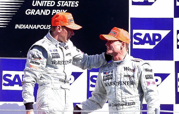 2001 American Grand Prix - Race Indianapolis, United States. 30th September 2001. Race winner Mika Hakkinen, West McLaren Mercedes MP4 / 16, is congratulated be team mate David Coulthard, (3rd)