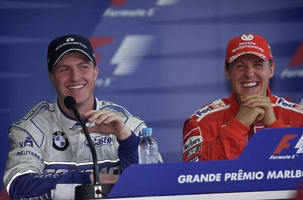 2001 Brazilian Grand Prix -Qualifying Sao Paulo, Brazil. 31st March 2001 Michael Schumacher, Ferrari talks with Ralf Schumacher, BMW Williams as the brothers secure first