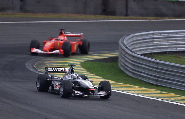 2001 Brazilian Grand Prix -Race Sao Paulo, Brazil. 1st April 2001 David Coulthard, West McLaren Mercedes leads Michael Schumacher, Ferrari - action. World Copyright -Steve Etherington  /  LAT Photographic ref: 15MB Digital
