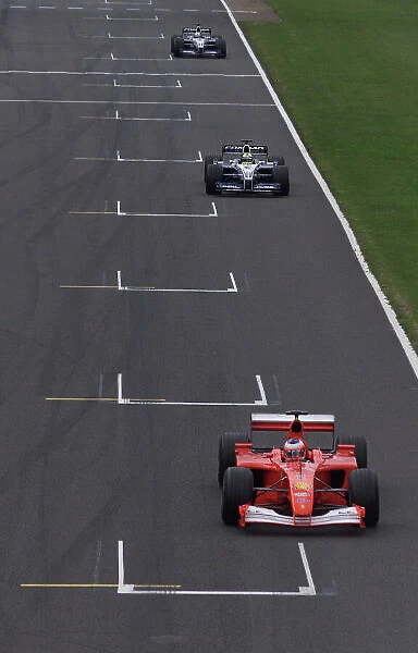 2001 British Grand Prix - race Silverstone, England. 15th July 2001. Rubens Barrichello, Ferrari F2001, leads Ralf Schumacher, BMW Williams FW23, and Juan Pablo Montoya, BMW Williams FW23