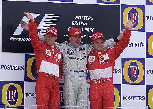 2001 British Grand Prix - Race. Silverstone, England. 15th July 2001. Race podium, Mika Hakkinen, West McLaren Mercedes MP4 / 16 (1st), Michael Schumacher, Ferrari F2001 (2nd) and Rubens Barrichello