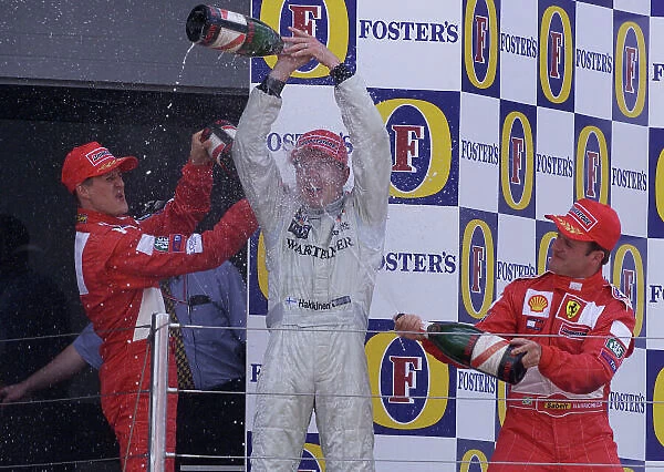 2001 British Grand Prix - Race. Silverstone, England. 15th July 2001. Race podium, Mika Hakkinen, West McLaren Mercedes MP4 / 16 (1st), Michael Schumacher, Ferrari F2001 (2nd) and Rubens Barrichello
